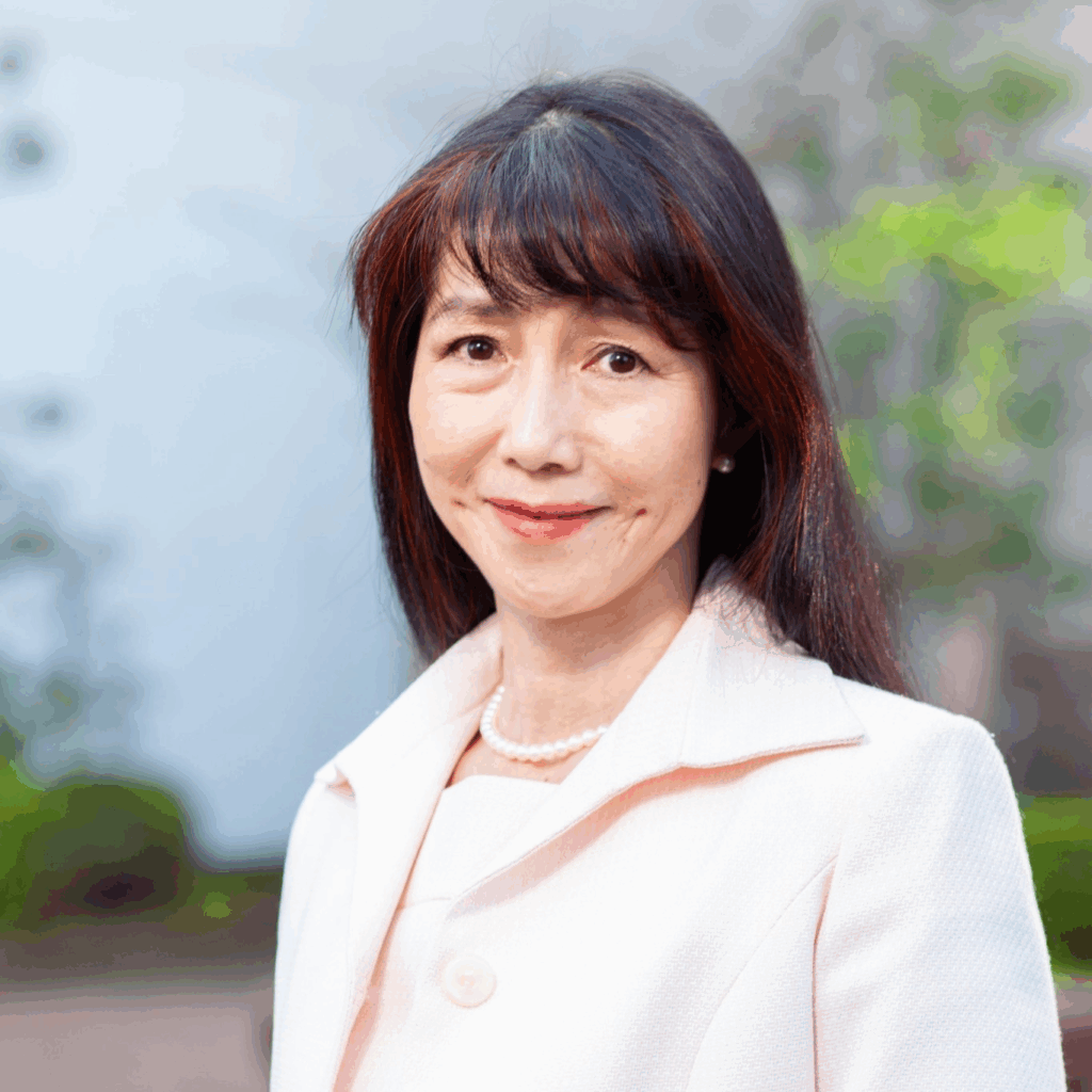 Miho Kanau, counselor at Grace Counseling Japan, wearing a pink suit